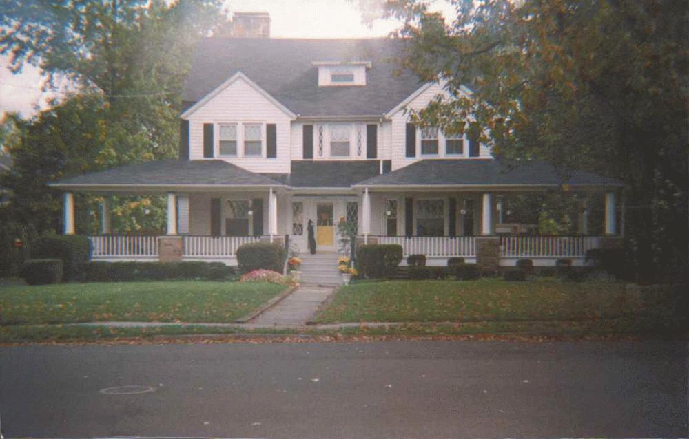 Colonial Revival with a full wraparound porch