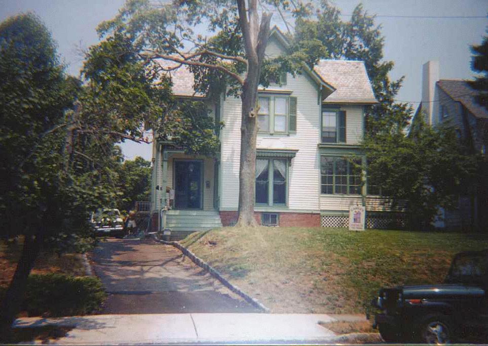 Two-tone exterior with green trim and shutters