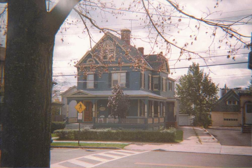 Queen Anne Victorian in deep blue with contrasting trim